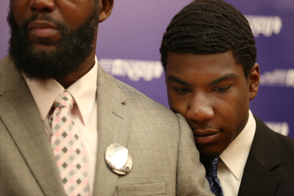 KISSIMMEE, Fla. August 2nd,  2013: Jahvaris Fulton, Trayvon Martin's brother rests his head on Tracy Martin's shoulder during the press conference about the Trayvon Martin Foundation at the National Association of Black Journalists Convention on Friday August 2nd, 2013. Monica Herndon | NABJ Monitor